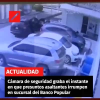 cámara de seguridad graba el instante en que presuntos asaltantes irrumpen en la sucursal del Banco Popular de la Avenida Luper